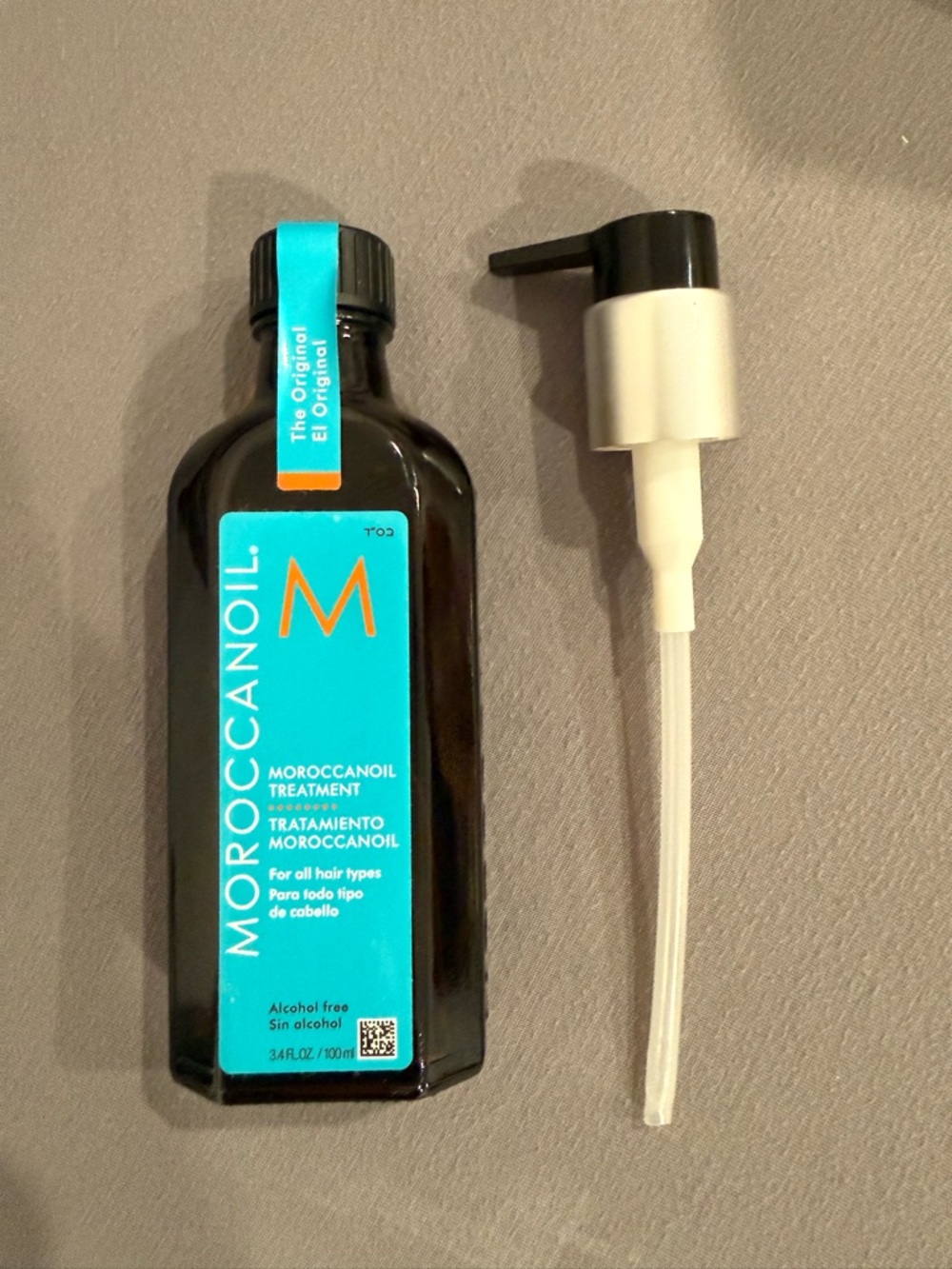 Moroccanoil Hair Treatment Bottle with Turquoise Label and Black Cap